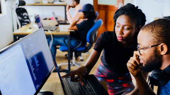 Young people working together at a laptop